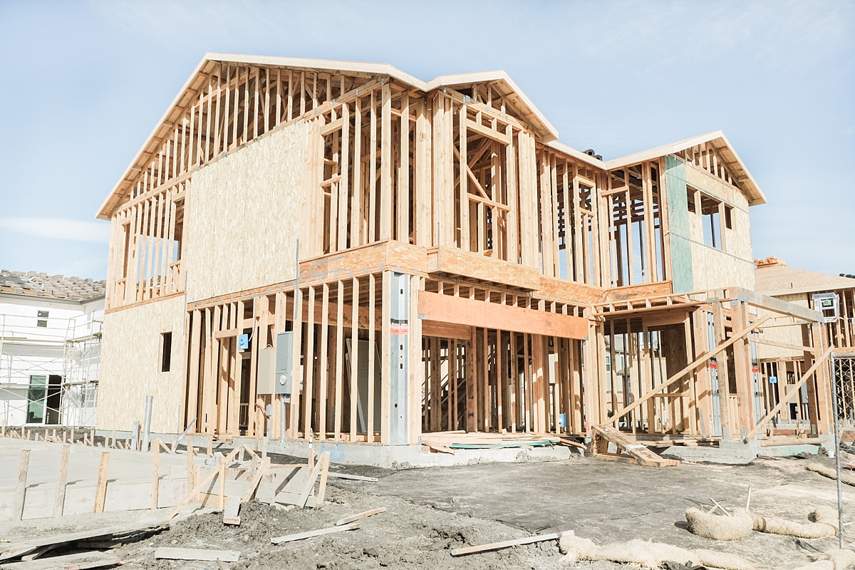 Side of the house with roof trusses and second floor