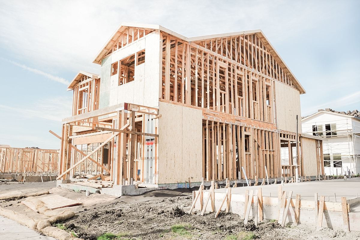 Side of the house with roof trusses and second floor