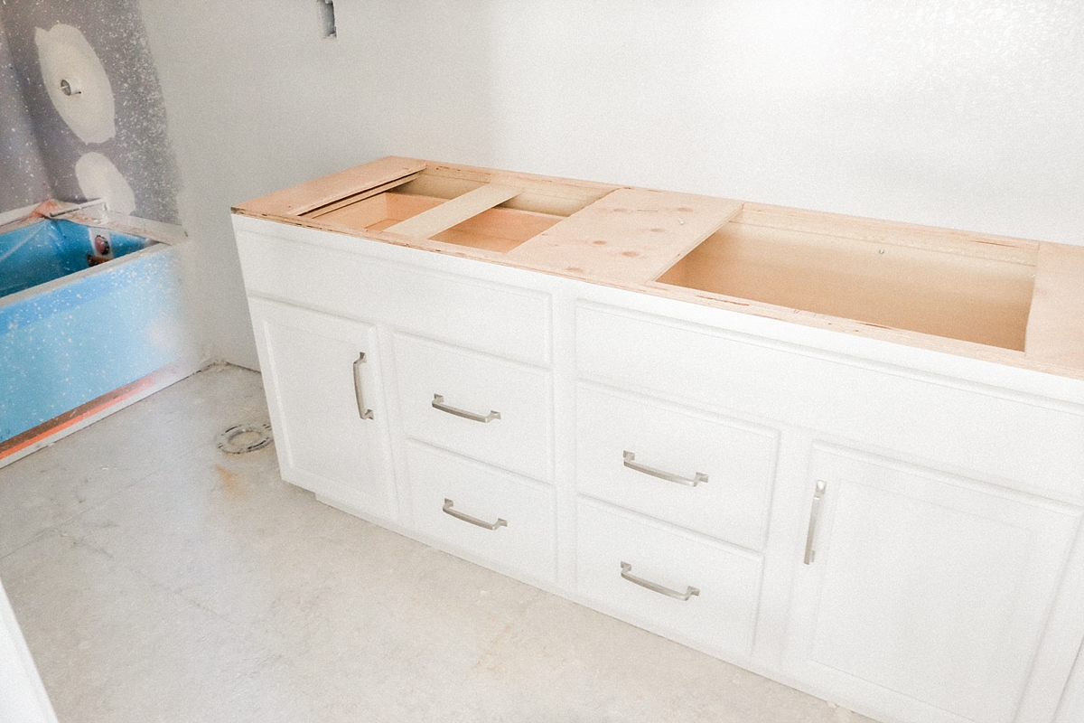 Guest bathroom cabinets and bath tub