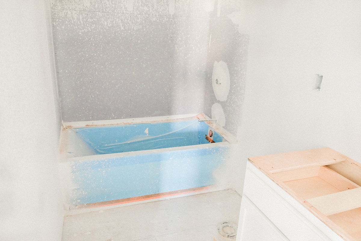 Guest bathroom cabinets and bath tub