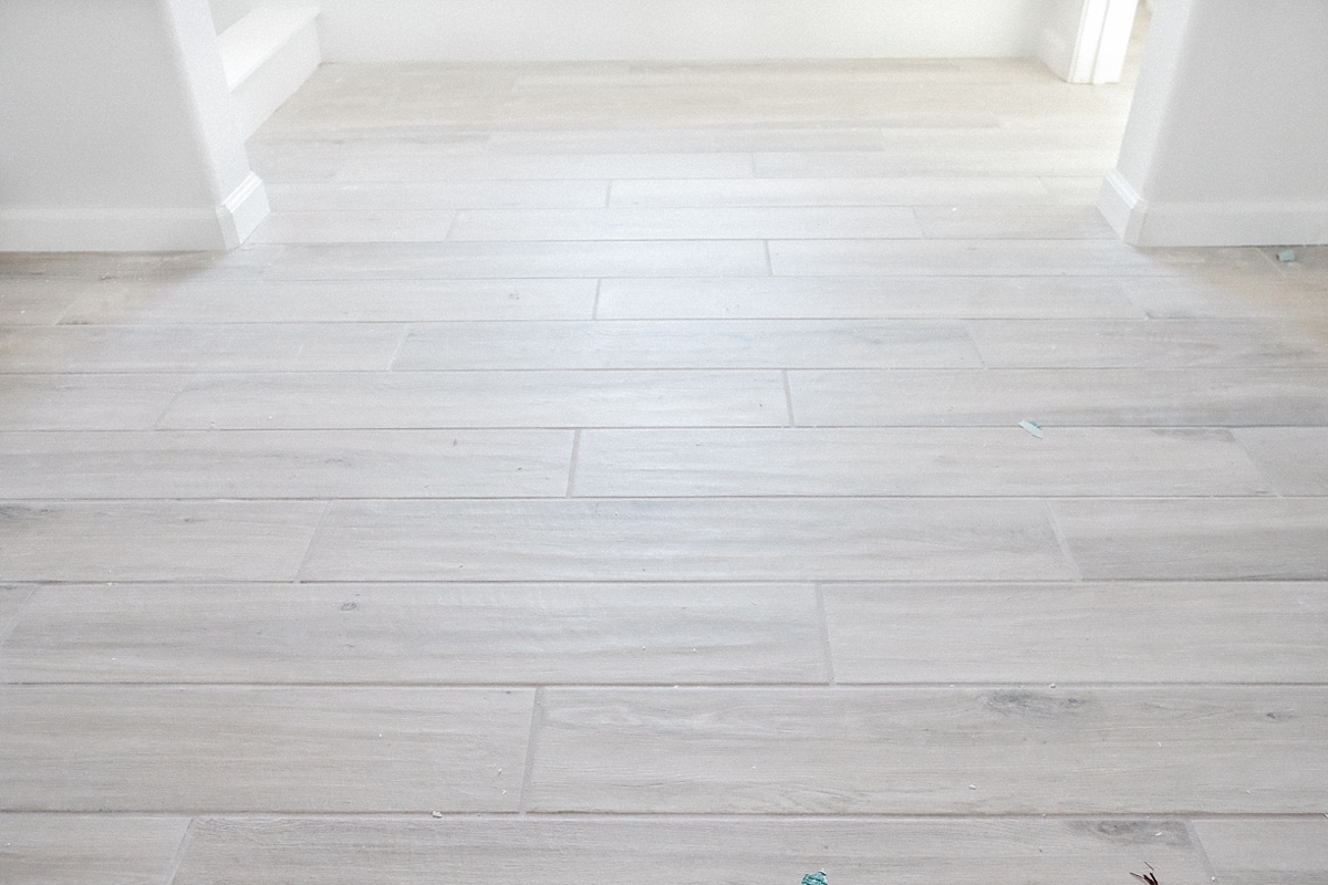 Wood look tile floor in master bathroom